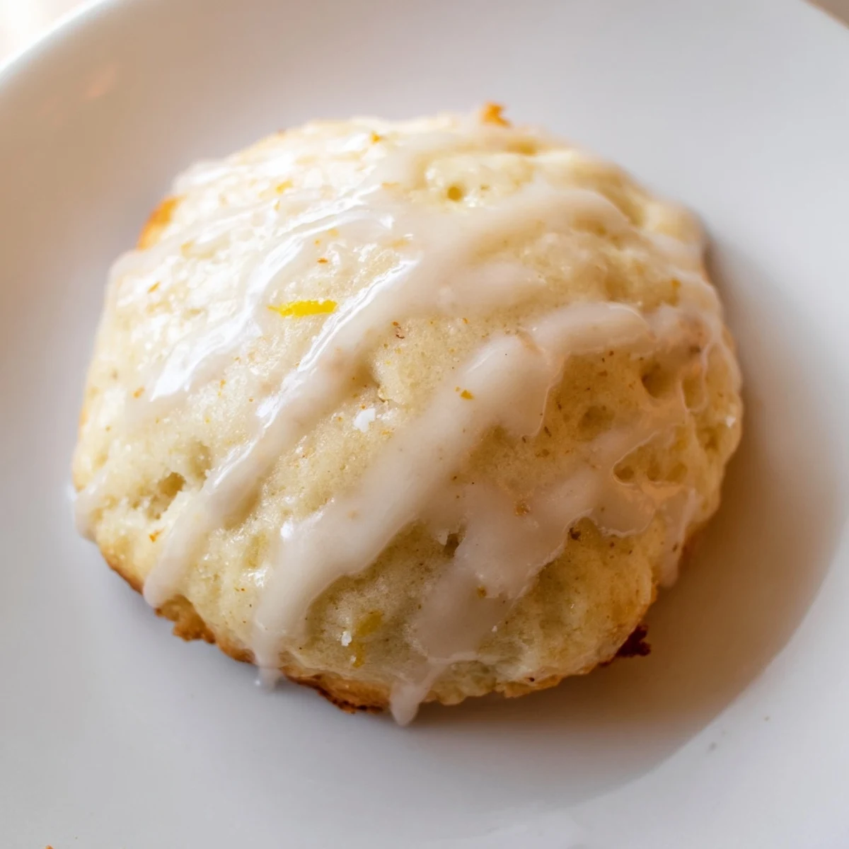A platter of soft Lemon Ricotta Cookies drizzled with bright lemon glaze, perfect for a spring dessert buffet.  