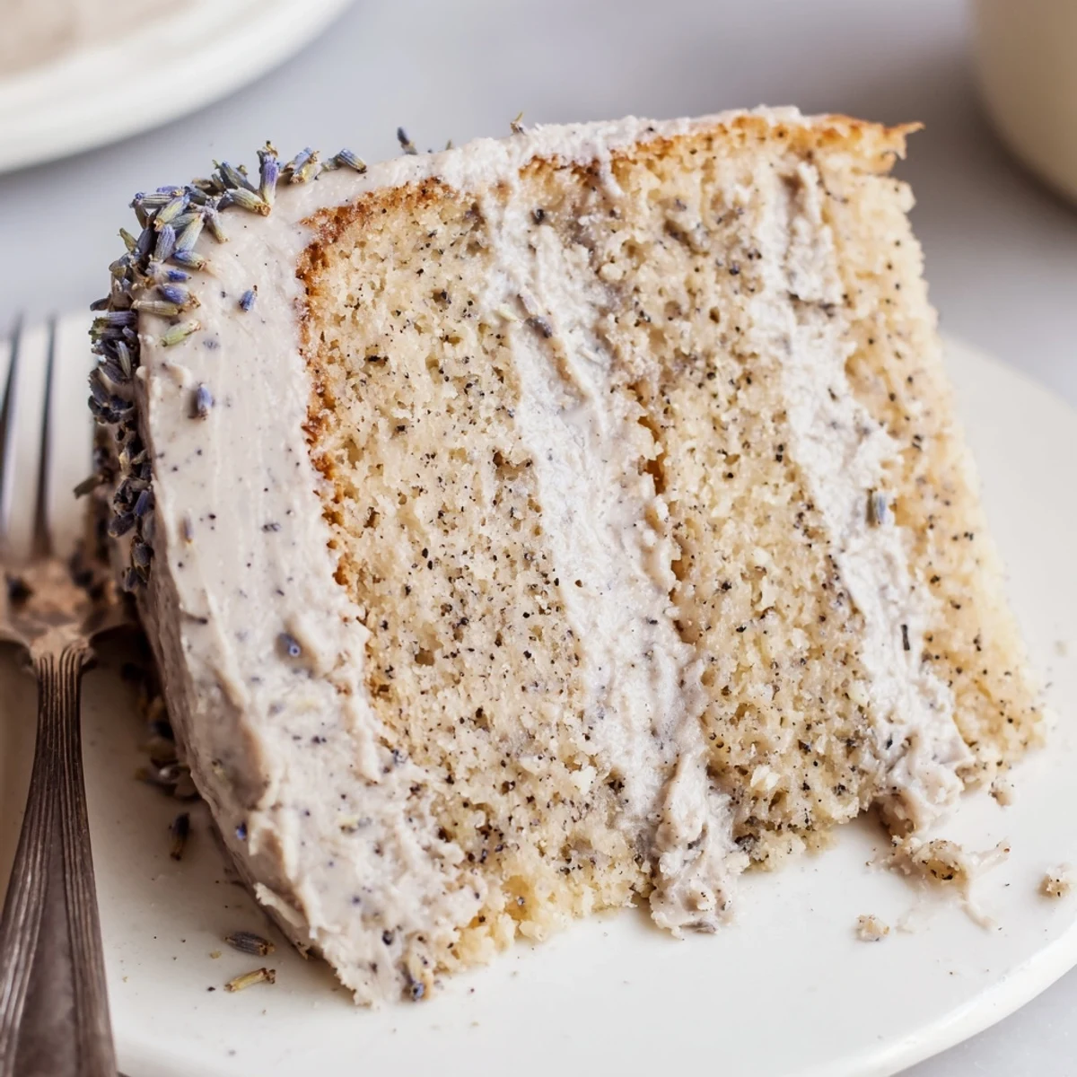 Delicate lavender-scented cake frosted with Earl Grey buttercream, ready to serve with a hot cup of tea.
