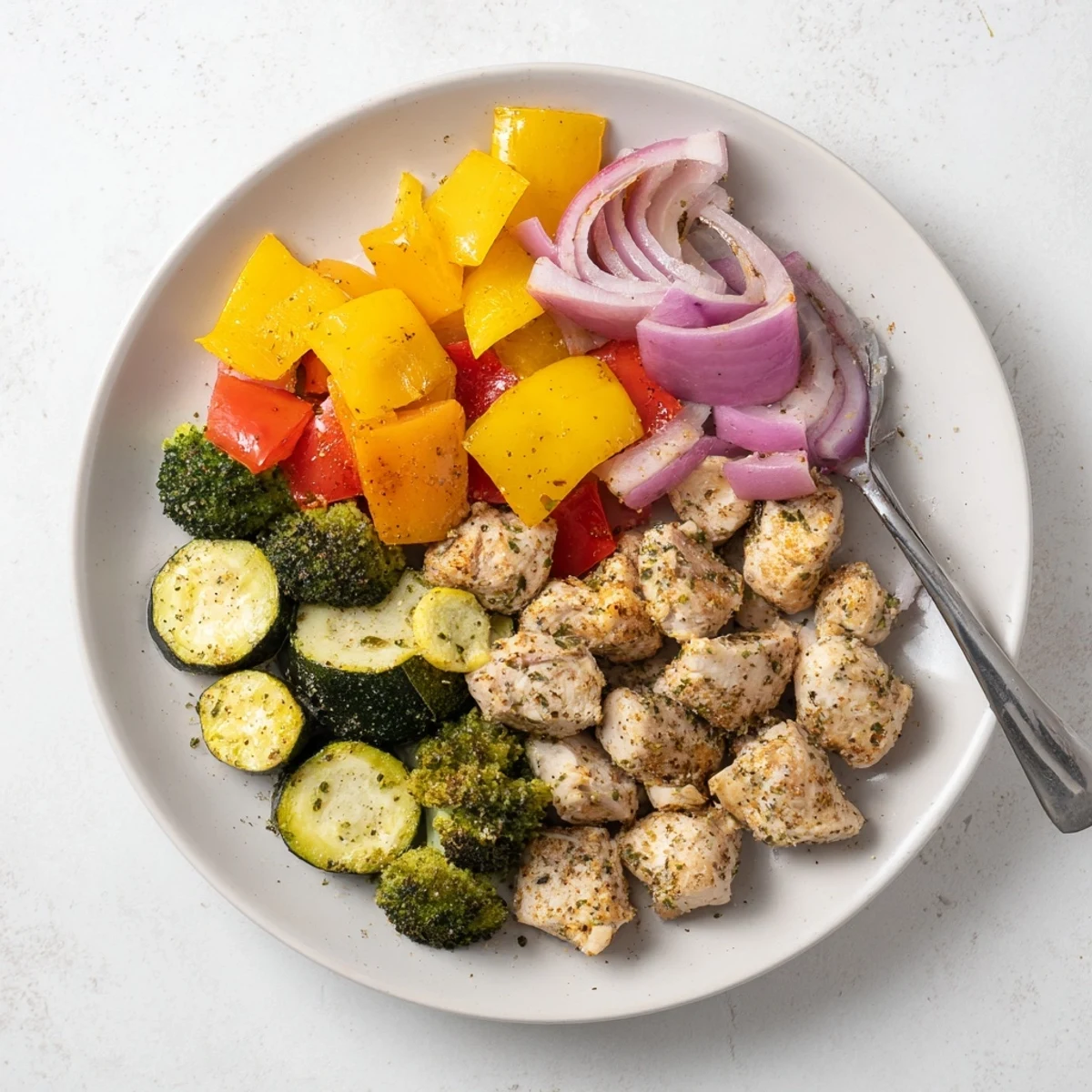 Sizzling 10-Minute Air Fryer Chicken and Veggies with colorful bell peppers and tender broccoli ready to serve.