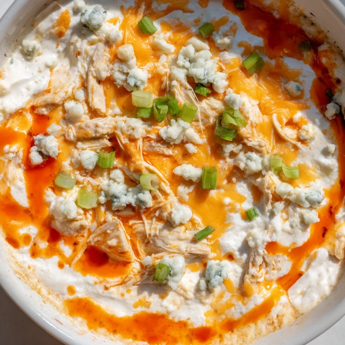 Steamy slow cooker dip loaded with shredded chicken and tangy buffalo sauce