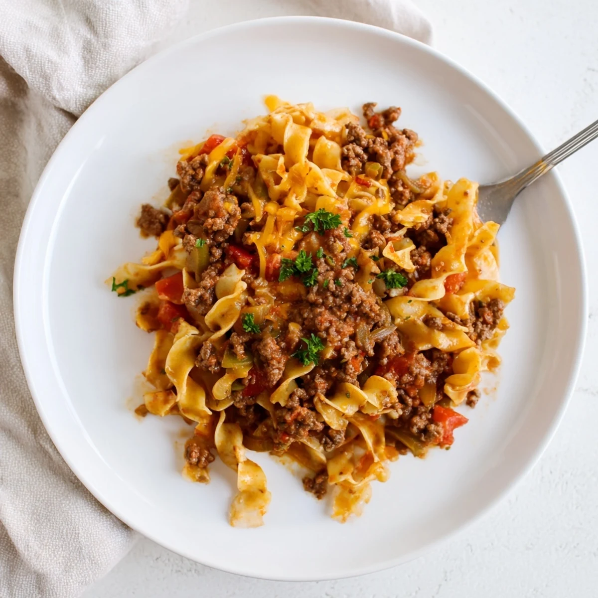 Warm Beef Noodle Casserole served family style with garlic bread and salad