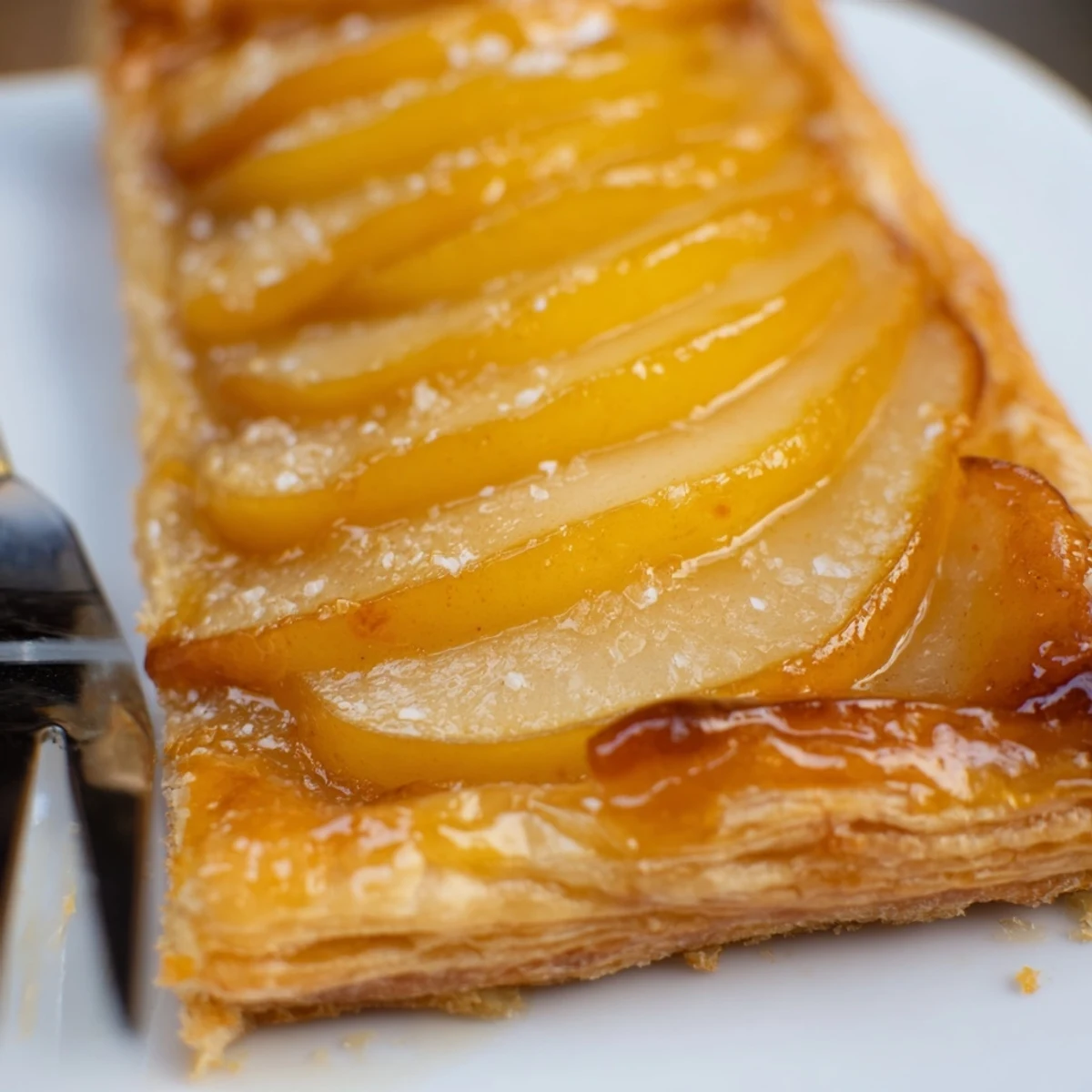 Pear Puff Pastry Recipe with golden flaky crust, glazed pears steaming warmly