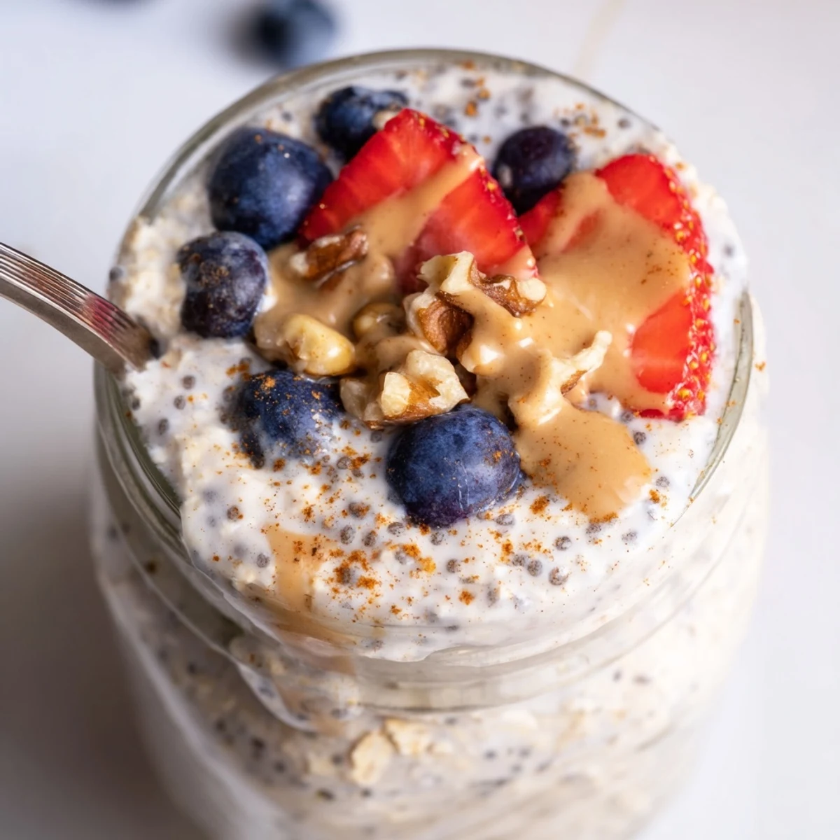 Chilled protein overnight oats layered with Greek yogurt and crunchy chia seeds