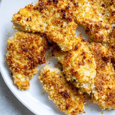 This delicious Baked Garlic Parmesan Chicken showcases a savory crust with tender juicy interiors, perfect for a family weeknight dinner.